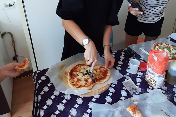 Mamma Mia! Authentic Italian Pizza Making Class - Eating the results: hot pizza plus beverages (and maybe more)