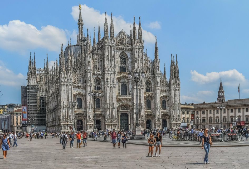 Milan: Private Guided Walking Tour with Aperitif - Walking the historic center: Castello Sforzesco, Merchant Square, and icons in context