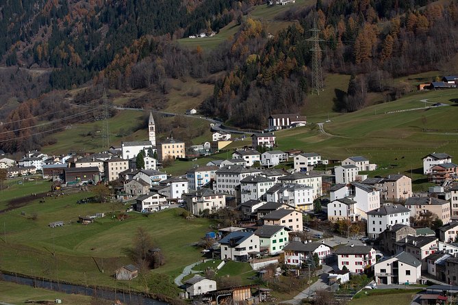 Swiss Alps Bernina Red Train and St.Moritz Tour from Milan - Ospizio Bernina to Tirano: Brusio Viaduct, spiral tunnels, and cliffside wonder
